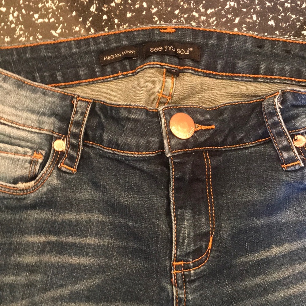 Dark skinny jeans with slight distressing